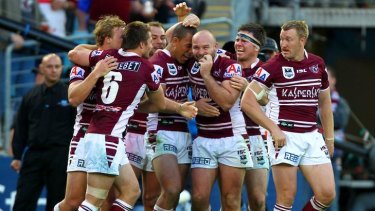 Winners ... Glenn Stewart is congratulated after scoring in Manly's grand final win earlier this year.