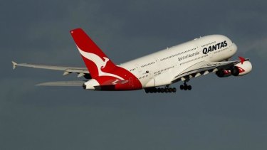 A man was thrown off a Qantas flight in NZ after ''aggressive'' behaviour towards cabin crew.