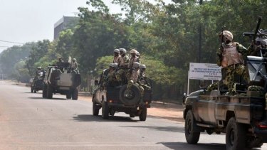The cavalry arrives: Burkina Faso troops ride into town.