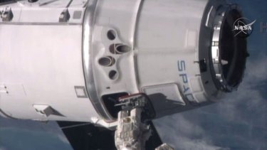 Astronauts onboard the International Space Station successfully capture the SpaceX Dragon spacecraft with the robotic arm as the station travels over the Mediterranean Sea.
