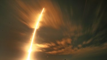 A  SpaceX Falcon 9 steaks off from launchPad 40, at Cape Canaveral Air Force Station, in Cape Caveral Florida, early on Saturday. 