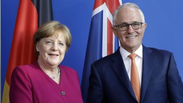 German Chancellor Angela Merkel, left, and Prime Minister Malcolm Turnbull, right, shake hands prior to a meeting at the Chancellery in Berlin on Monday.