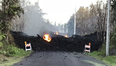 A street in Leiliani Estates near Pahoa on Hawaii's Big Island that is blocked by a lava flow from the eruption of Kilauea volcano on Friday.