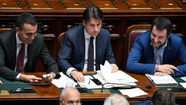 Italian PM Giuseppe Conte is flanked by Interior Minister Matteo Salvini, right, and Labour Minister Luigi Di Maio.