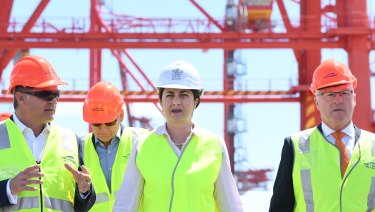 Queensland Premier Annastacia Palaszczuk (centre) and Local Government Association of Queensland president Mark Jamieson (right) are seen at the Port of Brisbane on Wednesday.