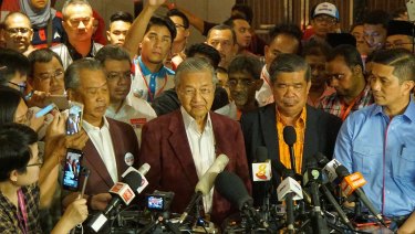 At a late-night conference, Mahathir told reporters it looked like Malaysia would have its first change in government in 61 years.