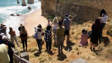 This photo, taken last Thursday, shows tourists who have jumped the barrier to take selfies at the Twelve Apostles.