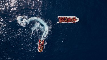 Refugees and migrants are rescued by members of the Spanish NGO Proactiva Open Arms, after leaving Libya trying to reach European soil aboard an overcrowded rubber boat last month.