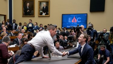 Congressman Markwayne Mullin greets Mark Zuckerberg as the Facebook founder faces a second day of questioning on Capitol Hill.