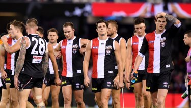Form slump: Saints players leave Etihad Stadium after their 39-point loss to the Demons.