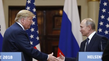 Who has the upper hand here? Donald Trump shakes hand with Vladimir Putin 