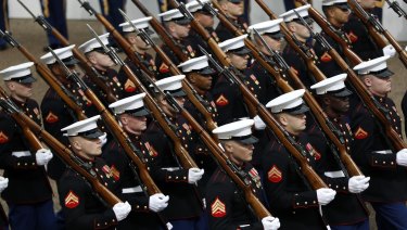 Military units march during the 58th Presidential Inauguration parade for President Donald Trump in Washington.