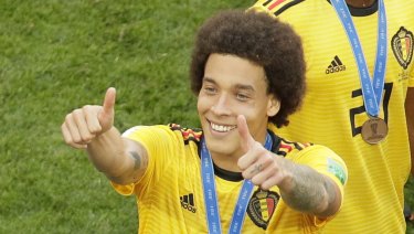 All smiles: Belgium's Axel Witsel gestures to fans after the win.