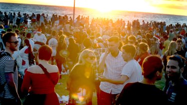 Thousands of people booze on St Kilda Beach on Christmas Day before police were called to intervene.
