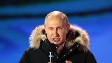 Russian President Vladimir Putin speaks during a rally near the Kremlin in Moscow.