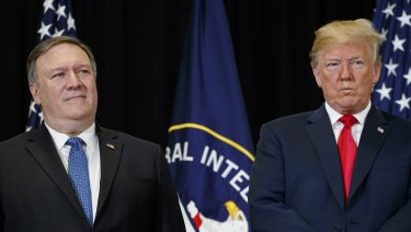 US President Donald Trump stands with Secretary of State Mike Pompeo 