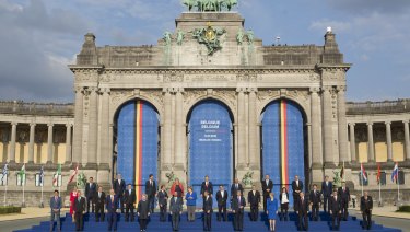 President Donald Trump on stage during a group photo of NATO heads of government at Park Cinquantenaire in Brussels, Belgium. 