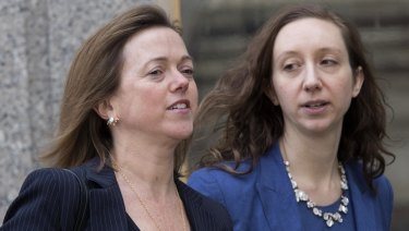Attorney Joanna Hendon, left, representing President Trump, leaves federal court on Friday.