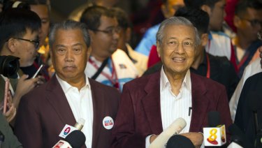 Mahathir Mohamad, right, speaks to media at a hotel in Kuala Lumpur, Malaysia, Wednesday.