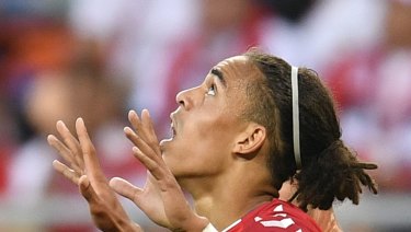 Great Dane: Towering Yussuf Poulsen looks to the skies after his goal against Peru