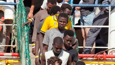Migrants disembark at the Reggio Calabria harbour, Southern Italy, on Saturday.