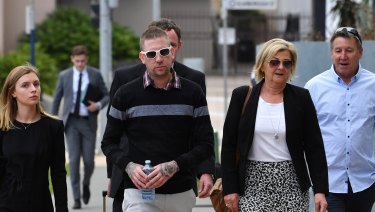 Kate Goodchild's husband Dave Turner (centre) and her father Shane Goodchild arrive for the inquest.