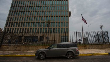 A car is parked outside the compound of the United States embassy in Havana, Cuba.