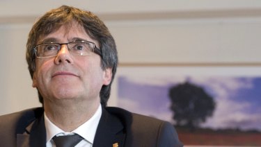 Ousted Catalan leader Carles Puigdemont attends a meeting in Brussels.
