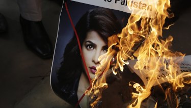 Activists of ultra right-wing Hindu Sena or Hindu Army burn posters featuring photographs of Indian actress Priyanka Chopra during a protest in New Delhi last week.