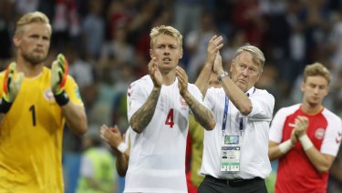 Tough ending: Denmark's players and coach Age Hareide after their shootout loss.