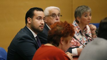 President Macron's former security aide Alexandre Benalla, left, appears before the French Senate Laws Commission in Paris.