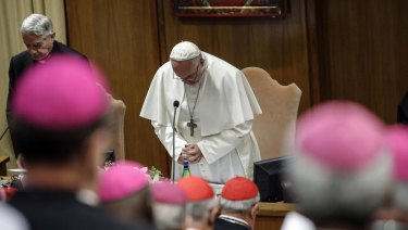 Pope Francis prays during the opening of the second day of a Vatican's conference on church sex abuse.