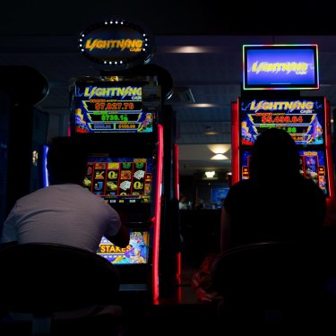 The standardised,
windowless decor of
many hotel gaming
lounges fosters a sense
of familiarity. NSW alone has 92,000 poker machines outside its casinos, compared with 43,000 in Queensland, the state with the next highest number. Western Australia has none.