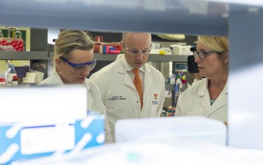 Carolyn Hogg (right), a University of Sydney population biologist, shows federal Environment Minister Sussan Ley and NSW Environment Minister Matt Kean the university’s Wildlife Genomics Group lab.
