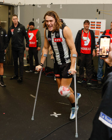 Darcy Moore was on crutches after the win over the Gold Coast Suns, but revealed Monday he had escaped structural damage.