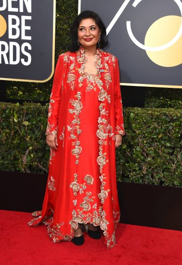 HFPA President Meher Tatna arrives at the 75th annual Golden Globe Awards.