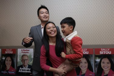 Victorious Labor candidate for Reid Sally Sitou celebrating with son Max husband Rui on election night. 