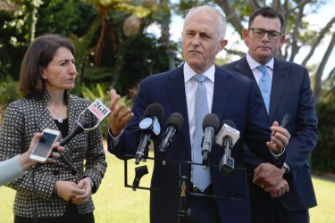 Prime Minister Malcolm Turnbull on Friday, flanked by premiers Gladys Berejiklian and Daniel Andrews to announce both states had joined the redress scheme.