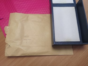 The pink gift bag, brown envelope and empty blue archive box in which two notebooks belonging to Charles Darwin were anonymously returned.