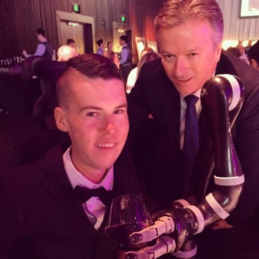 Daniel Michel shares a drink with Steve Waugh. 