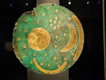 The Nebra Sky Disc, the oldest-known representation of the cosmos anywhere in the world, appears to smile at visitors.