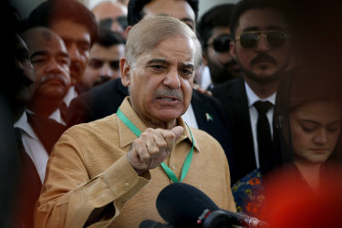Pakistan’s opposition leader Shahbaz Sharif, speaks to reporters outside the Supreme Court.