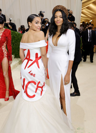 Alexandria Ocasio-Cortez in her controversial “tax the rich” gown, pictured alongside fashion designer Aurora James.