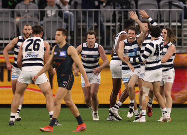 Geelong celebrate after a goal from Isaac Smith.
