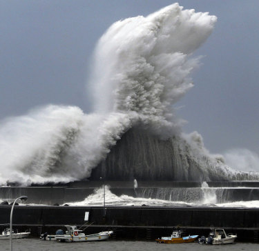 High waves hit breakwaters at a port of Aki, Kochi prefecture, Japan, on Tuesday.