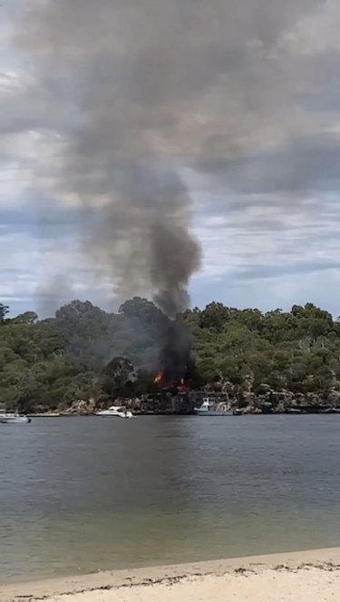 A fire started at Blackwall Reach near a popular cliff-jumping spot on Monday. 