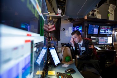 A trader works on the floor of the New York Stock Exchange (NYSE) in New York. 