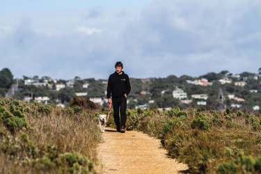 Shaw walking above the cliffs east of Anglesea.