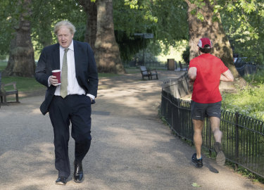 Britain's Prime Minister Boris Johnson takes a morning walk at St James's Park in London before returning to Downing Street, Wednesday May 6, 2020.