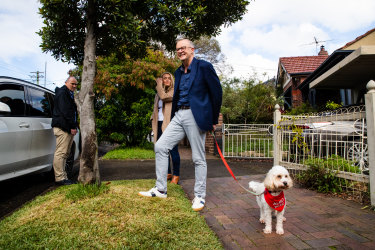 Prime Minister-elect Anthony Albanese, partner Jodie Haydon and dog Toto walking out of their Marrickville house.